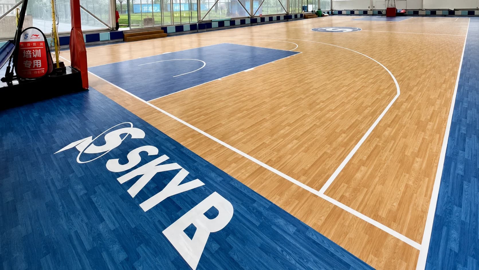 Completed indoor wood-look basketball sports floor